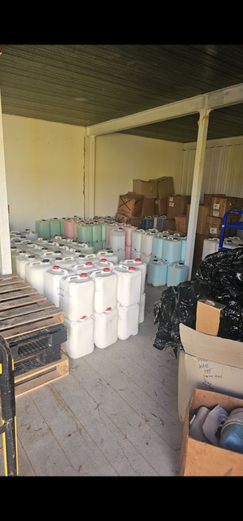 Commercial storage room packed with containers – before removal