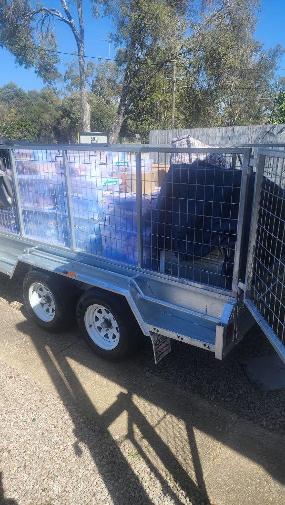 Real Estate Cleanout – loaded cage trailer ready for removal Brisbane Bayside